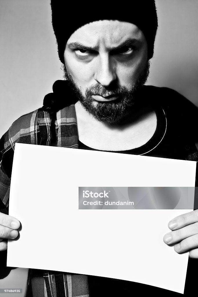 Detenidos hombre que agarra un blanco de hoja - Foto de stock de Adulto libre de derechos