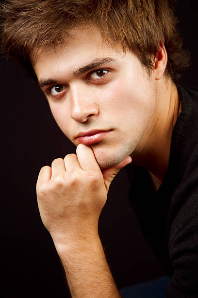 istock Handsome masculine man with hand at chin 97487236