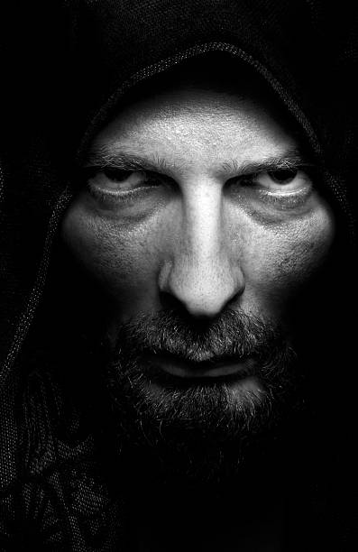 Dark portrait of scary evil sinister man stock photo