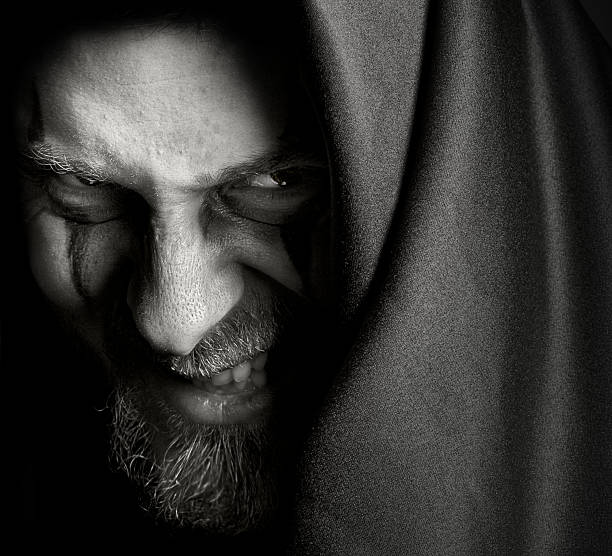 istock Evil sinister man with malefic wicked grin 97487259