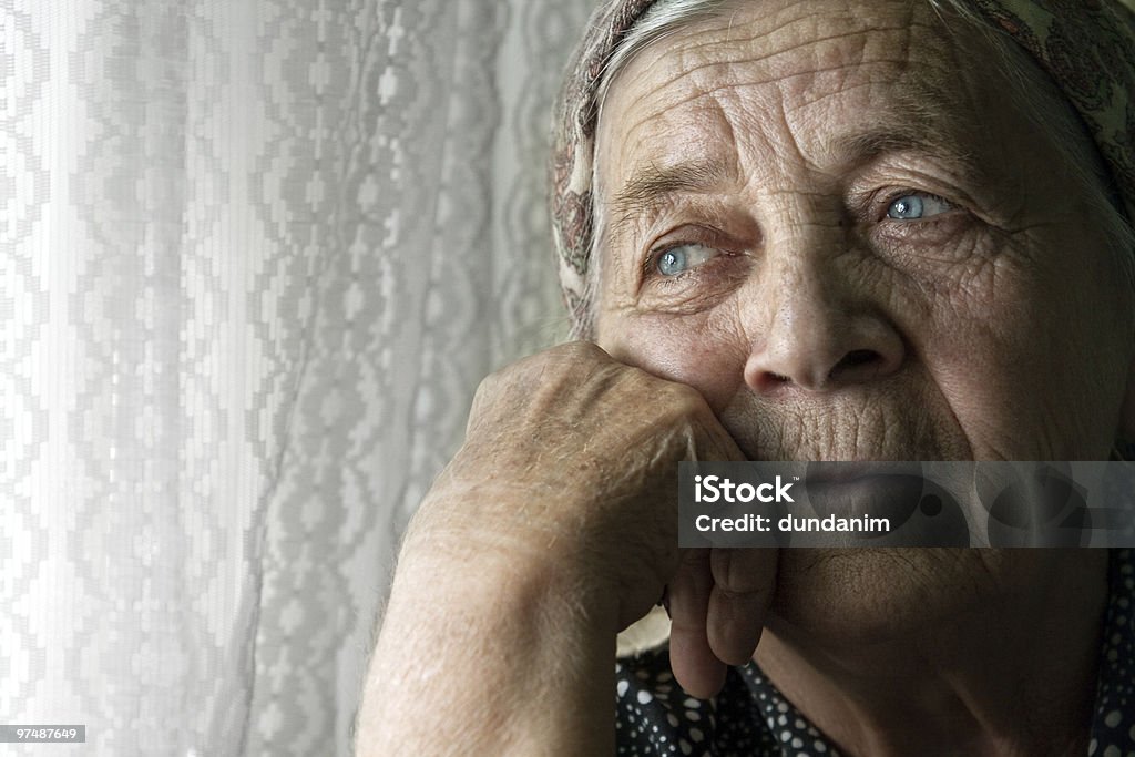 Sad lonely pensive old senior woman Portrait of sad lonely pensive old senior woman Senior Adult Stock Photo