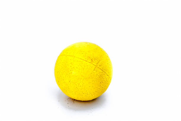 istock Yellow colored sponge ball isolated on white. 974876522