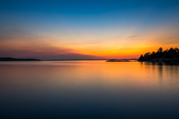 Sunset on Georgian Bay at Parry Sound Simple yet beautiful sunset on Georgian Bay at Parry Sound, Ontario, Canada in the center stock pictures, royalty-free photos & images