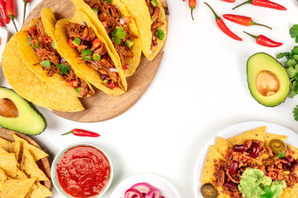 istock Overhead photo of typical Mexican dishes on white with copy space 974884088