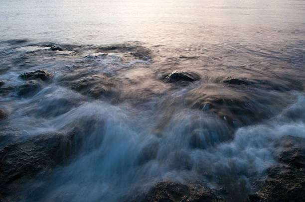 Long exposure shot of a rocky beach in Camiguin