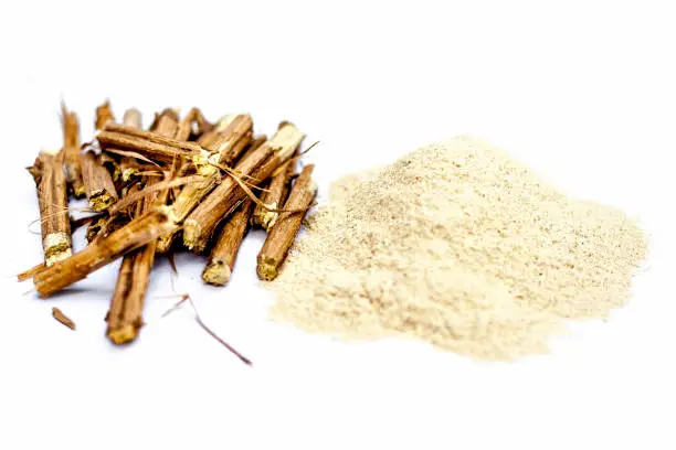 Ashwagandha roots and its powder also known as Indian ginseng, isolated on white essential beneficial for hair loss,
