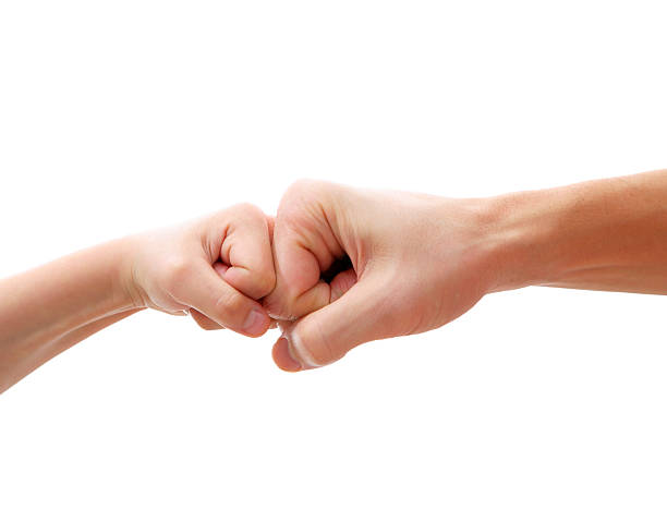 istock big and little hands as fists together 97489466