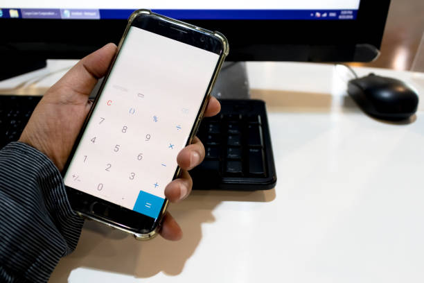 istock Calculator application  in mobile phoneIn the man hand 974896896