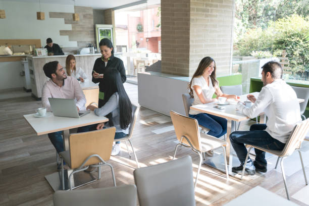 istock People eating at a restaurant 974905796