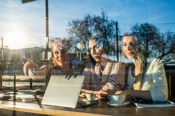 istock Female student pointing at something from cafeteria. 974915700