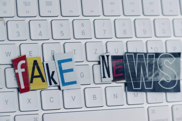istock Fake news text on white keyboard 974916134