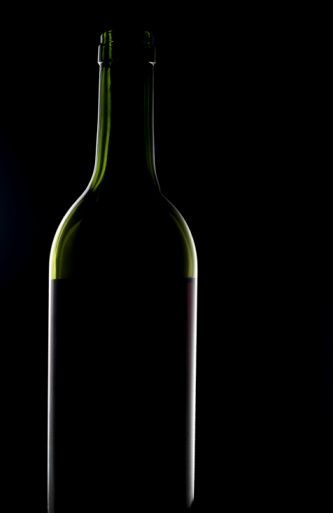 Wine bottles on black background . Isolated black background.