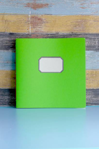 istock Green Square brochure on multi colored shabby chic background 974921374