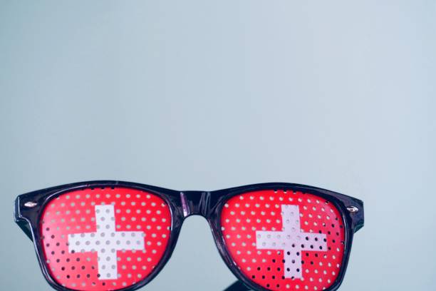 istock Switzerland flag sunglasses on blue background 974922682