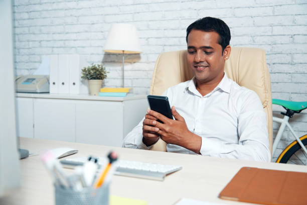 istock Businessman texting on phone 974923966