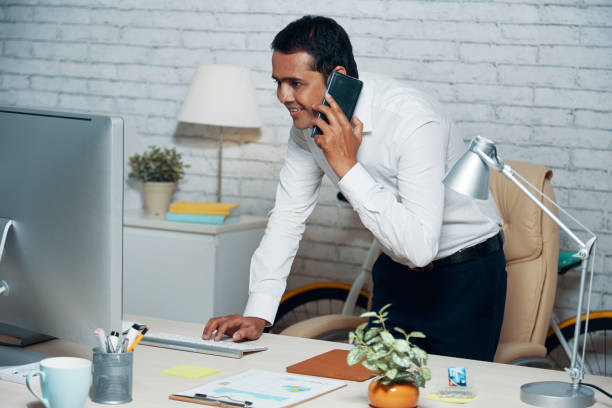 istock Businessman answering phone call 974923982