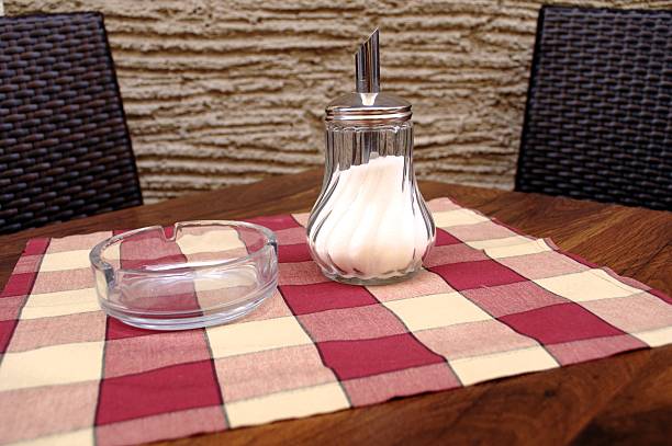 cigarette ashtray standing on tile floor