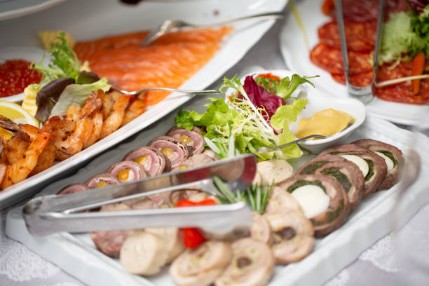 istock Breakfast meals variety in restaurant flat lay. Top view on buffet table with different tasty snacks. 974936368