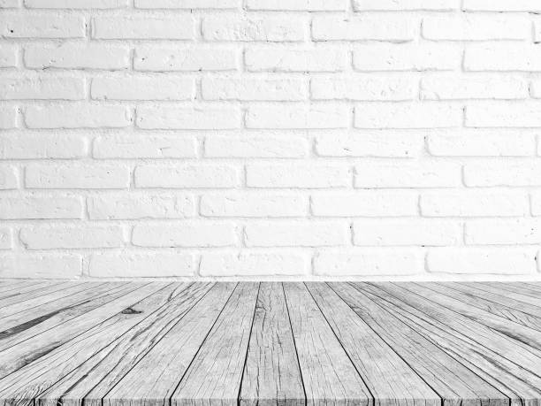 istock gray brick stone cement wall background textured with aged wood tile floor for advertisement or promote product 974936594