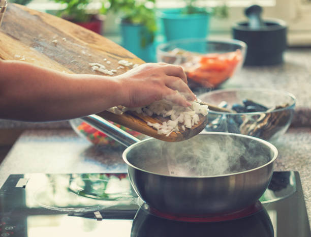 Young Woman Preparing Paella