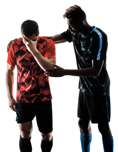 istock soccer players men isolated silhouette white background 974941294