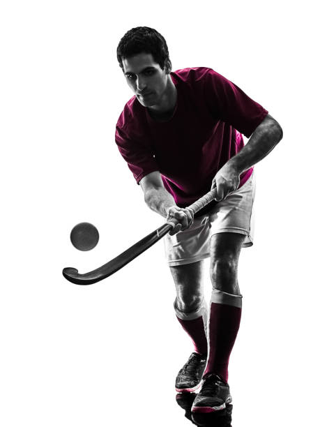 istock field hockey player man isolated silhouette white background 974941716