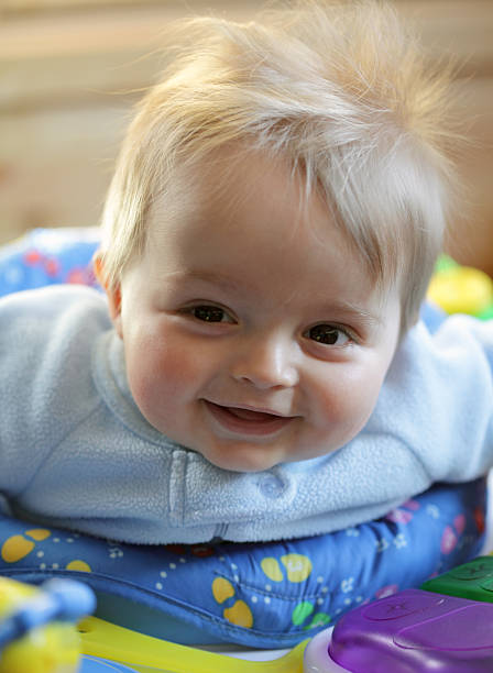 istock Baby boy smiling and playing 97494567
