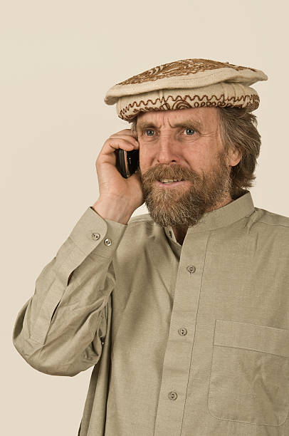 istock Man in Pakistani Clothes Phoning 97494629