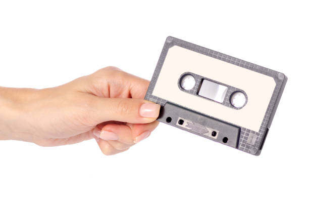 istock Audio cassette in hand stereo music 974952114
