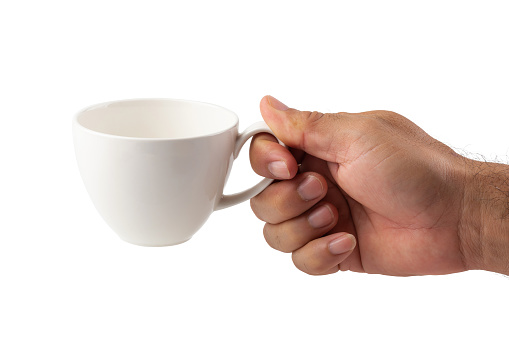 Hands of a man holding a coffee mug on a white background.