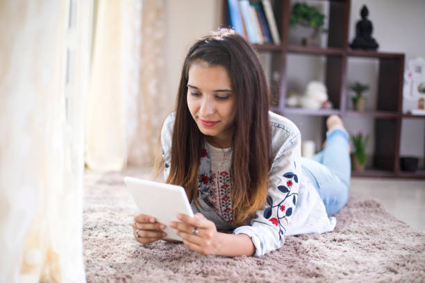 istock Woman relaxing on carpet 974969774