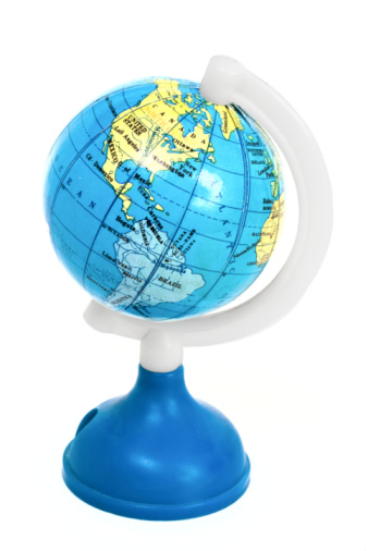 Small toy globe with South America and Atlantic Ocean isolated on white background