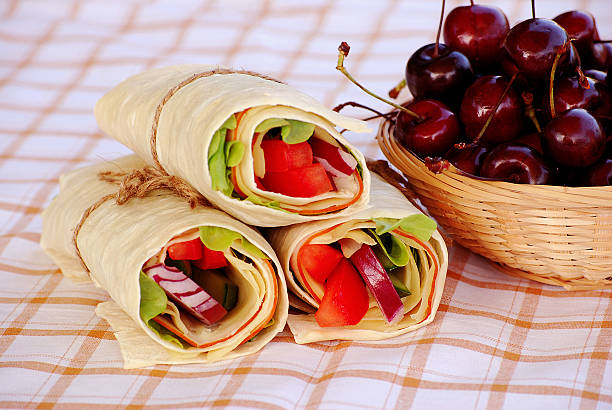Wrap sandwiches on a table cloth  bread bun corn bread basket stock pictures, royalty-free photos & images