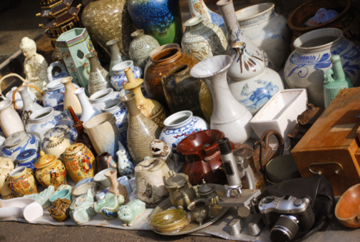 Japanese antique store is filled with a variety of products such as pottery, antiques, and miscellaneous goods.