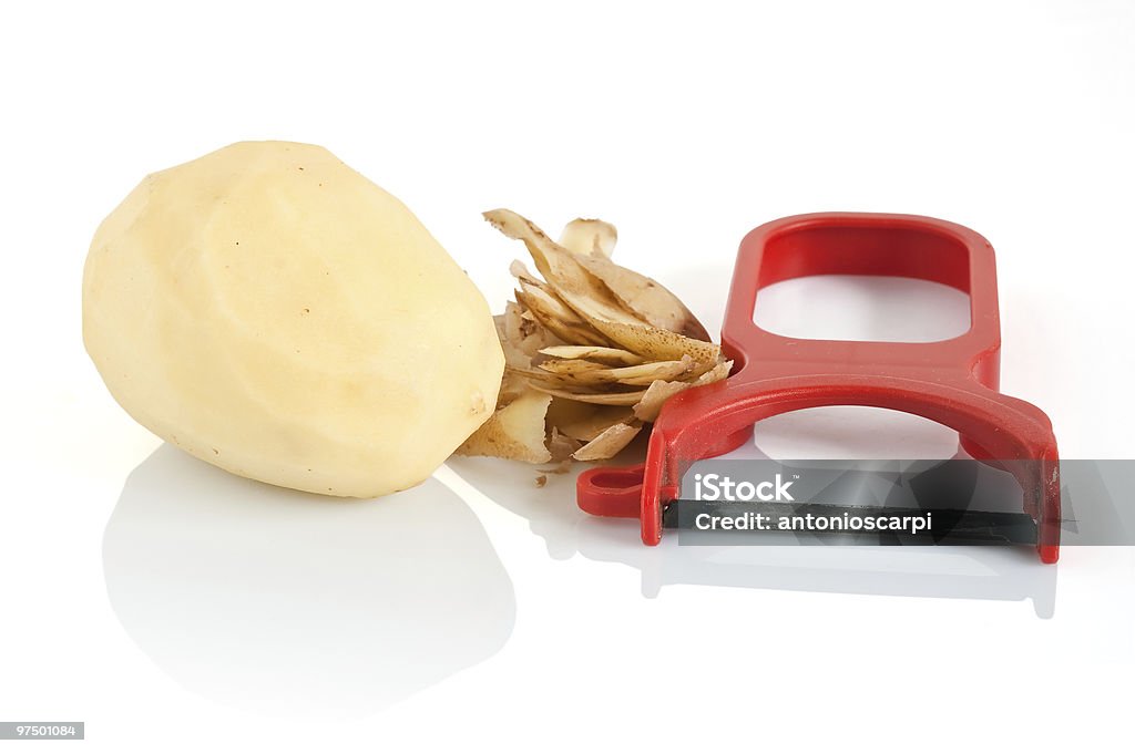 Sbucciatore con patate - Foto stock royalty-free di Articoli casalinghi