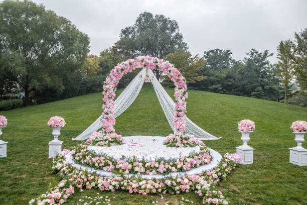 istock Flower decoration and wedding ceremony on green lawn 975018746