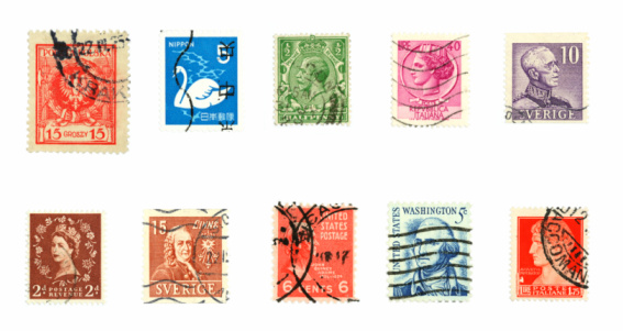 Cairo, Egypt, December 10 2021: A collection of old historic used postage stamps from various countries of the world of different times, places and values, selective focus of many post stamps