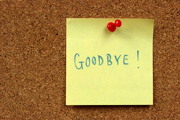 istock Sticky note reading Goodbye pinned to cork board 97502186