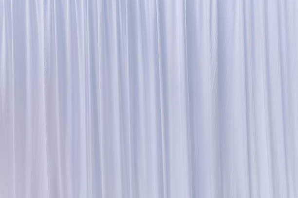 istock White curtain or drapes background 975024240