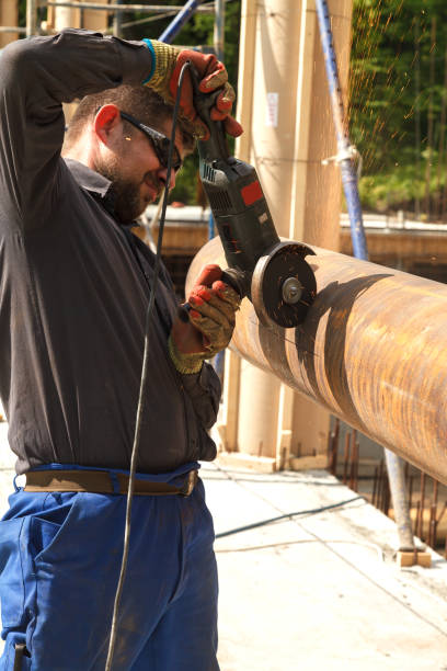 istock Man cuts flex steel products 975025490