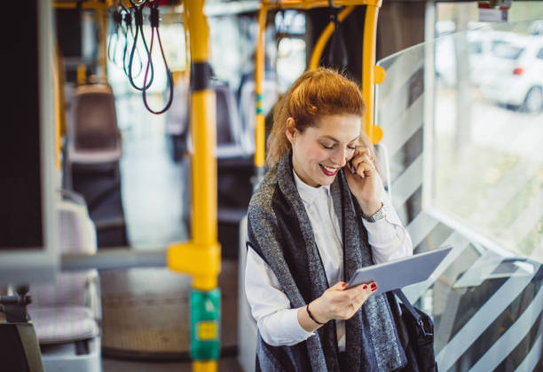 istock Businesswoman Taking Public Transportation 975027032
