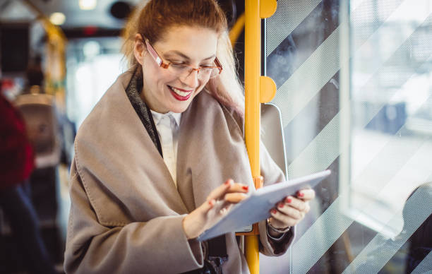 istock Businesswoman Taking Public Transportation 975032532