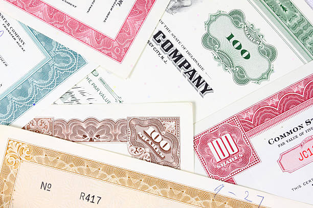 istock Multiple stock certificates in different colors 97503258