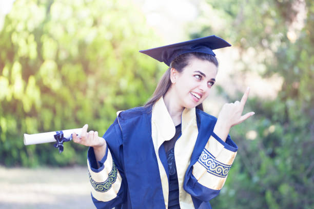 istock Young woman thinking future after graduation. 975045604