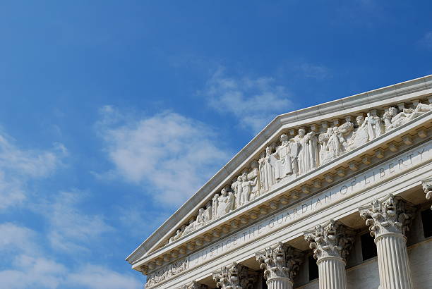 Justice the Guardian of Liberty back of U.S. Supreme Court Enscription on the back side of the US Supreme Court (rarely seen by most visitors, who pass by only the front of the building). us supreme court building stock pictures, royalty-free photos & images