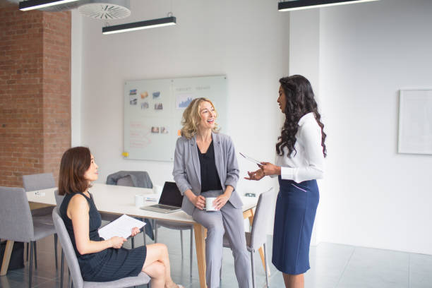 istock Small business, three women talking in office 975053844