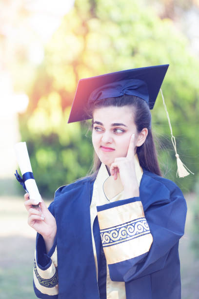 istock Young woman thinking future after graduation. 975059274