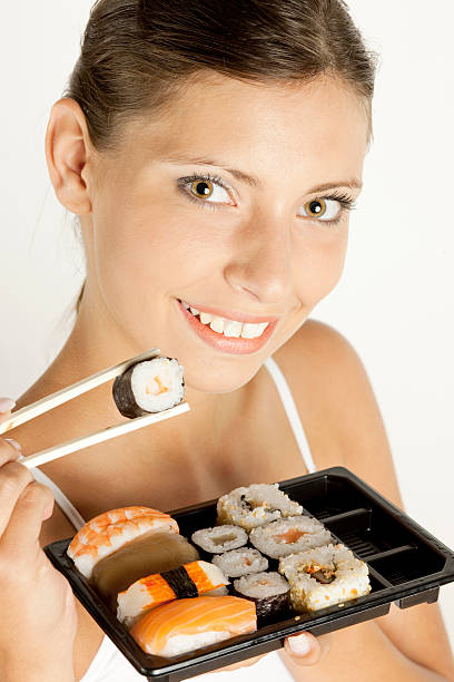 istock woman with sushi 97505956