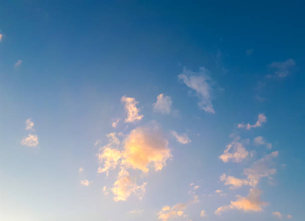 istock white-yellow clouds in the blue sky 975060316
