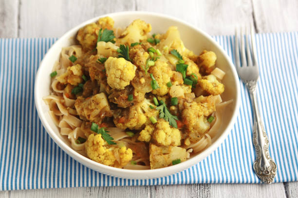 istock Cauliflower stew with curry. Vegetarian cuisine. 975060606
